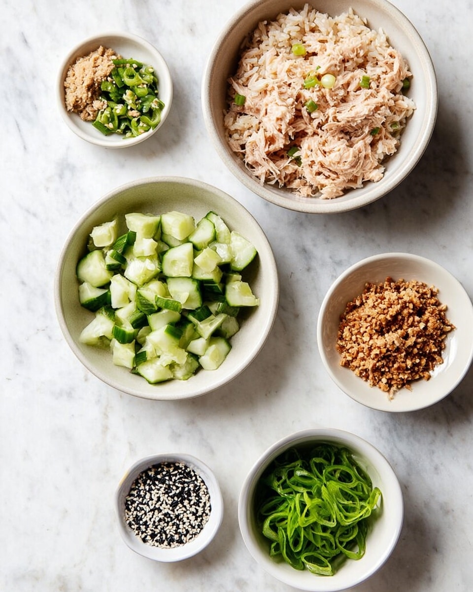 The image shows six small white bowls on a white marbled surface, each with different ingredients arranged separately. The top right bowl contains a fluffy pile of cooked rice, light beige in color, with visible grains. Below the rice, a larger white bowl holds a mix of light pinkish shredded tuna with small green bits mixed in. To the left, there is a white bowl filled with bright green chopped cucumber pieces, cut into small cubes. Above it, a small white bowl has a mix of brown crushed nuts and green herbs. The bowl on the bottom right contains vibrant green sliced spring onions, while the smallest bowl at the bottom center is filled with a mix of black and white sesame seeds. Photo taken with an iphone --ar 4:5 --v 7