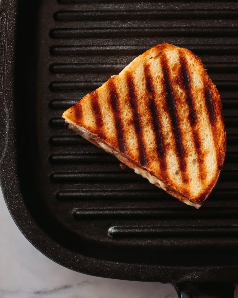 The image shows a sandwich with three clear layers standing on a wooden surface. The bottom layer is a thick piece of grilled bread, light beige with a toasted, slightly rough texture. The middle layer contains diced tomatoes, red onion pieces, and green herbs mixed together, with a creamy white spread beneath it. The top layer is another thick slice of grilled bread with dark grill marks, and a drizzle of dark balsamic glaze running down the side. Photo taken with an iphone --ar 4:5 --v 7