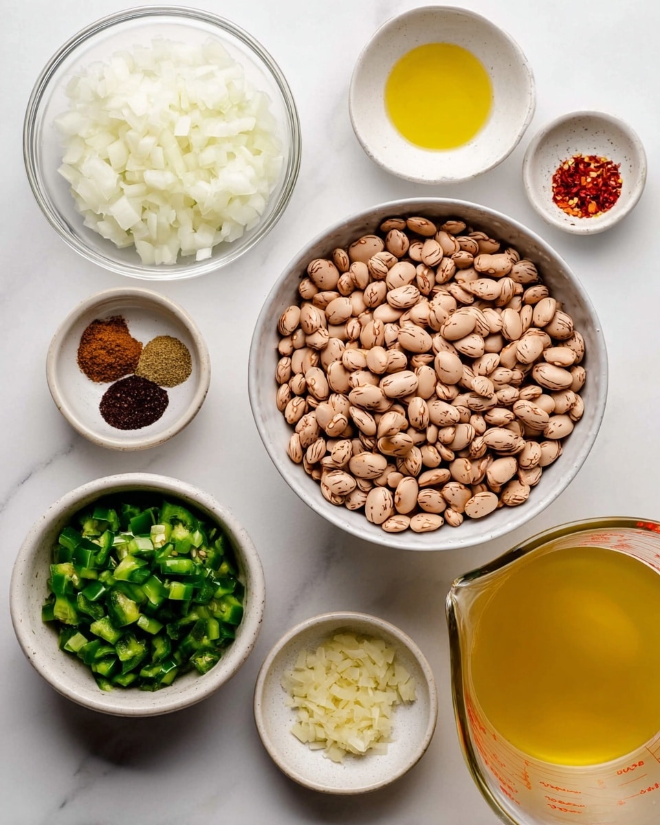 The image shows seven bowls with different ingredients arranged on a white marbled surface. At the center is a large white bowl filled with light brown speckled beans. To the top left is a clear glass bowl filled with chopped white onions. Above the beans is a small white bowl containing pale yellow oil. To the right of the oil is another small white bowl with five spices in separate small piles: light brown, dark brown, red, black, and white. Below and to the left of the beans is a small round bowl with chopped green peppers. Next to it is a small round bowl with finely minced pale yellow garlic. In the bottom right corner, a glass measuring cup is filled with light yellow broth. The overall colors include soft browns, greens, whites, and yellows, all resting on a clean white marbled surface. Photo taken with an iphone --ar 4:5 --v 7