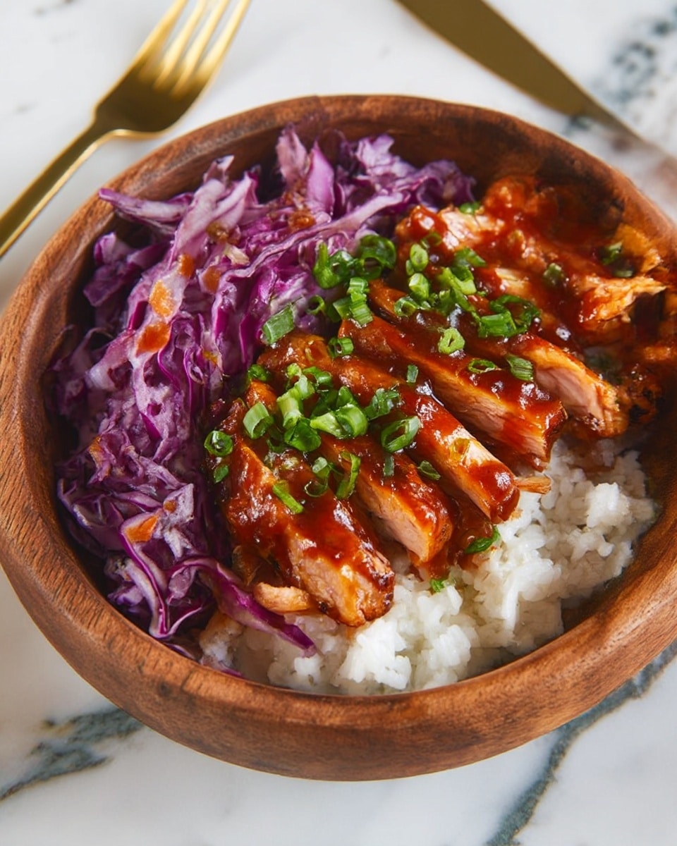 The dish in a round wooden bowl has three layers: the bottom layer is white rice with a soft texture, on one side a pile of thinly sliced purple cabbage with a fresh and crisp look, and on the other side pieces of grilled chicken covered in a shiny reddish-brown sauce, garnished with chopped green onions scattered over the top. The bowl sits on a white marbled surface with a gold fork in the background. Photo taken with an iphone --ar 4:5 --v 7