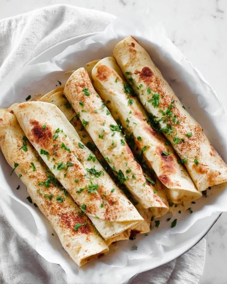 Musakhan Rolls with Shredded Chicken, Sumac, and Toasted Almonds Recipe