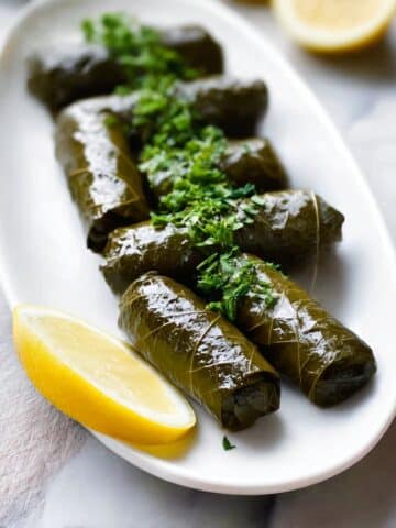 Dolmadakia-Stuffed Grape Leaves with Yogurt and Herb Sauce Recipe
