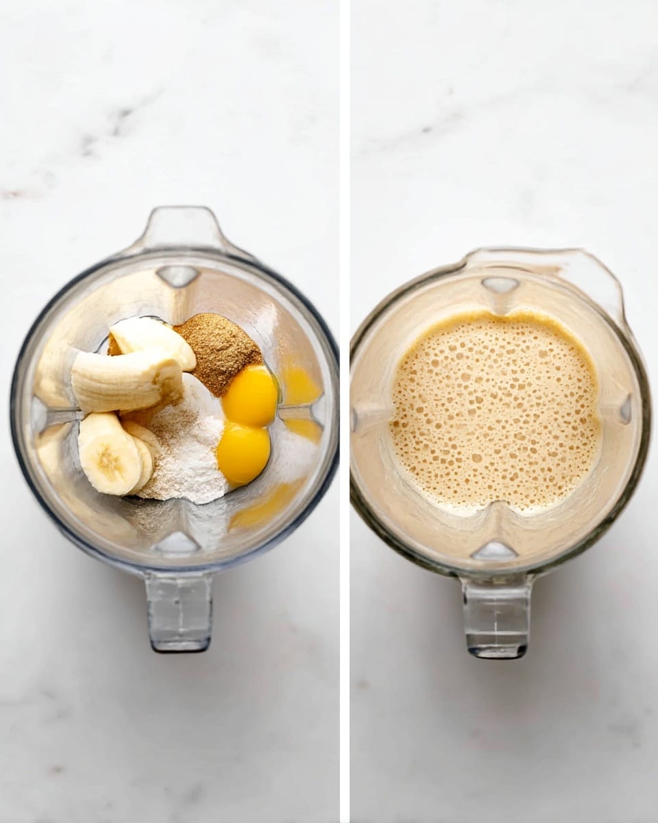 The image shows a clear blender jar from above placed on a white marbled surface. On the left side, the blender contains two light yellow banana pieces, light brown sugar, a bright yellow egg yolk, and a small amount of white powder, all clearly separated inside the jar. On the right side, the blender jar is filled with a smooth, creamy light beige mixture with a slightly foamy texture on top, evenly spread inside the jar. Photo taken with an iphone --ar 4:5 --v 7