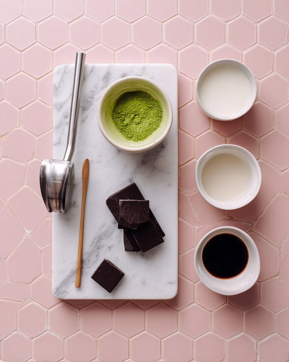 The image shows a top view of a white marbled board placed on a white marbled surface with a pink hexagon pattern background. On the board, there is a silver milk frother on the left, a thin wooden matcha scoop next to it, a small white bowl filled with bright green matcha powder in the middle, and two square pieces of dark chocolate positioned below the bowl. To the right of the board, three small white bowls are arranged in a rough triangle; the top bowl contains dark soy sauce, the middle bowl is filled with white milk, and the bottom bowl is empty. photo taken with an iphone --ar 4:5 --v 7