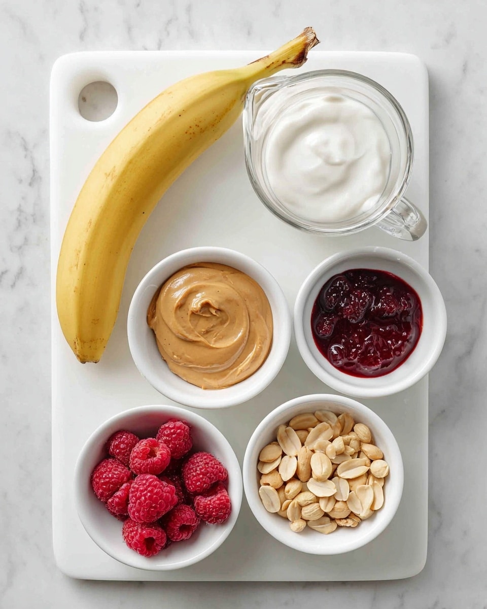 The image shows a white cutting board on a white marbled surface, with six different food items arranged neatly. On the left side, there is a whole yellow banana with a few brown spots on its peel. On the top left of the board is a clear plastic measuring cup filled with thick white yogurt, showing a smooth and creamy texture. To the right of the yogurt, there are four small white bowls positioned in a square pattern. The top right bowl contains two uneven dollops of dark red jam with a shiny texture. Below it, the bottom right bowl holds a handful of shelled peanuts, light brown and dry. The bottom left bowl is filled with fresh red raspberries, which look plump and juicy. The middle left bowl contains a smooth spoonful of light brown peanut butter with a velvety appearance. The white marbled background and white cutting board create a clean and bright setting. photo taken with an iphone --ar 4:5 --v 7