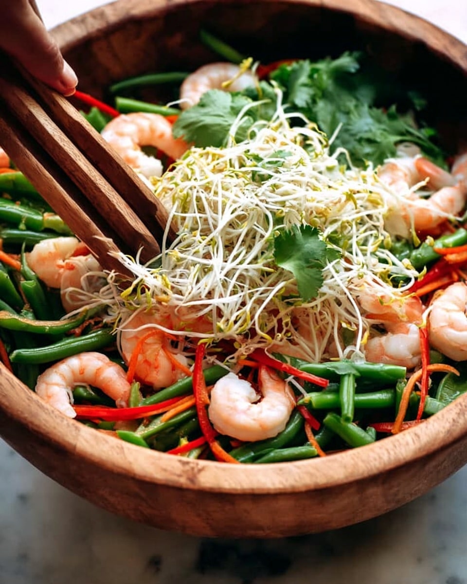 A close-up image of thin white rice noodles arranged loosely in a white bowl. The noodles have a delicate, smooth texture and are piled softly in a random tangle, creating a light, airy appearance. The bowl sits on a white marbled surface, with gentle lighting highlighting the translucent quality of the noodles. The overall look is clean and simple, focusing on the fragile strands of noodles inside the bowl photo taken with an iphone --ar 4:5 --v 7