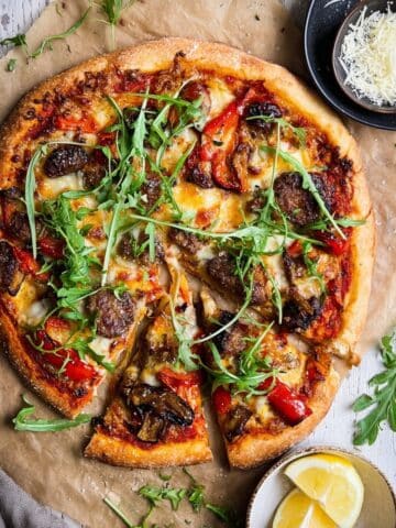 Sausage, Mushroom, and Bell Pepper Pizza with Arugula and Mozzarella Recipe