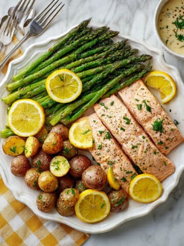 Sheet-Pan Spring Salmon with Roasted Potatoes, Asparagus, and Dilly Sauce Recipe