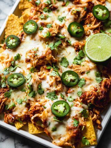 Shredded Chicken Nachos with Melted Monterey Jack and Toppings Recipe