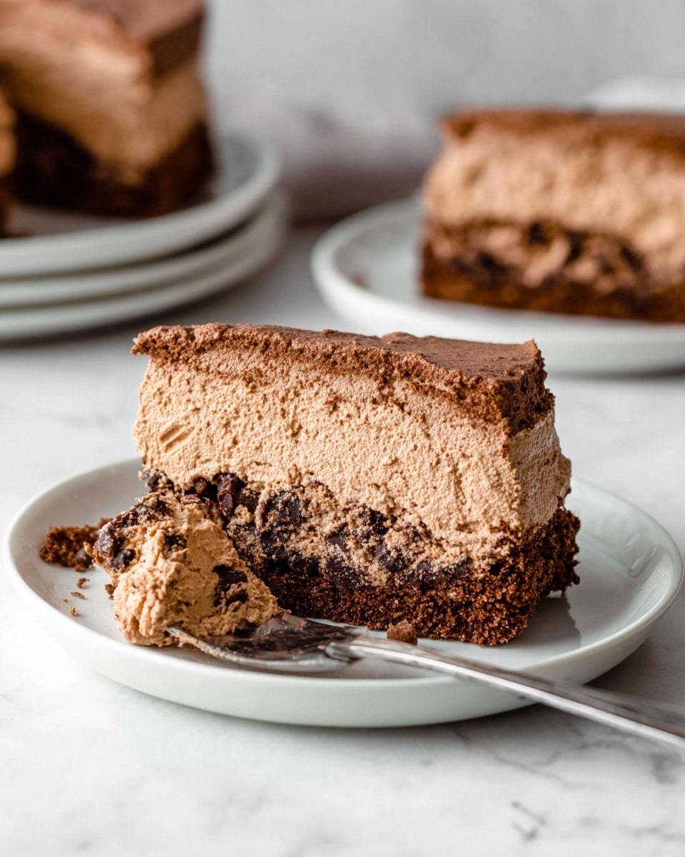 A rectangular cake covered with light brown chocolate cream, formed into a smooth soft texture. The cake is decorated with three large round chocolate chip cookies evenly spaced on top, and more cookies are lined closely around the sides, all showing their golden brown color and dark chocolate chips. The coffee-colored cream fills the gaps between the cookies, creating a uniform, slightly textured surface. The cake sits on a white marbled surface. photo taken with an iphone --ar 4:5 --v 7
