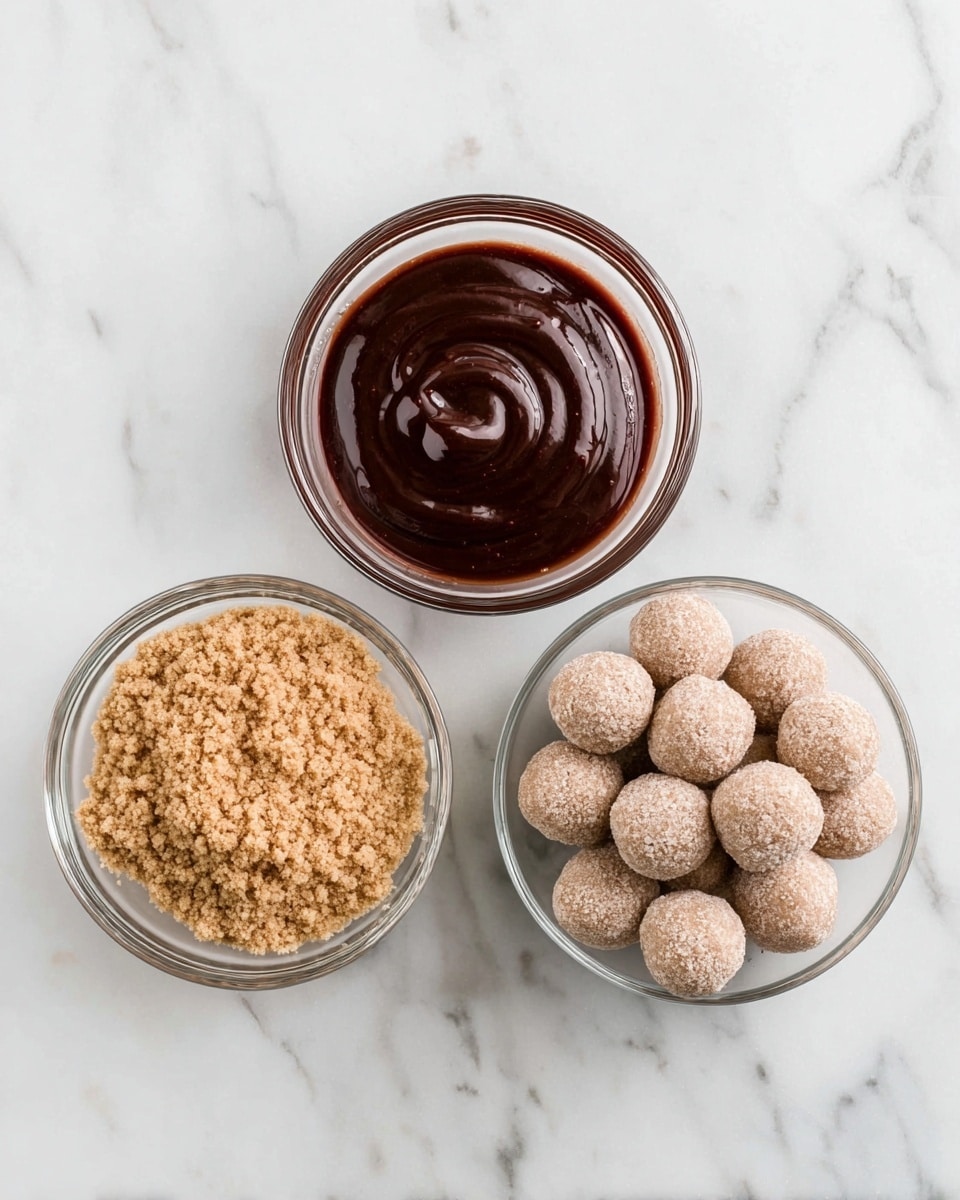 The image shows three clear glass bowls placed on a white marbled surface. The top bowl contains a smooth, dark brown sauce with a shiny texture and gentle swirls on its surface. The left bowl holds light brown, crumbly, and grainy brown sugar filling the bowl evenly. The bottom right bowl is filled with round, beige-toned textured balls that look dry and powdery, piled loosely in the bowl. Photo taken with an iphone --ar 4:5 --v 7