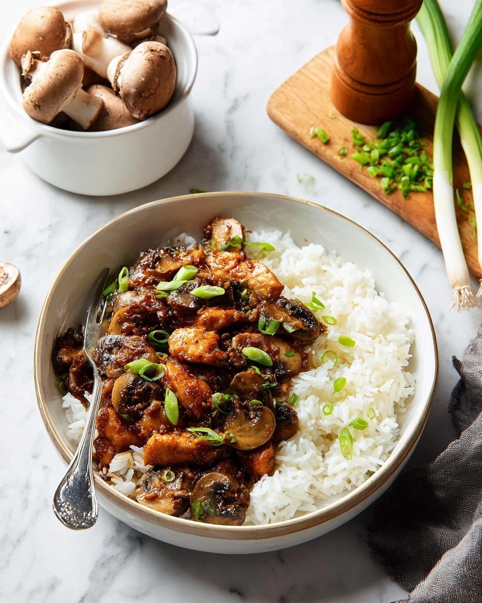 The image shows a close-up of a dark, non-stick wok filled with a stir-fry dish. The dish has several pieces of golden-brown cooked chicken scattered throughout, mixed with sliced mushrooms that have a dark brown color and slightly soft texture. Bright green onion slices are dispersed in the dish, adding a fresh touch among the rich brown sauce coating everything. A wooden spatula rests inside the wok, partially submerged in the glossy sauce and ingredients. The background shows a white marbled surface. Photo taken with an iphone --ar 4:5 --v 7