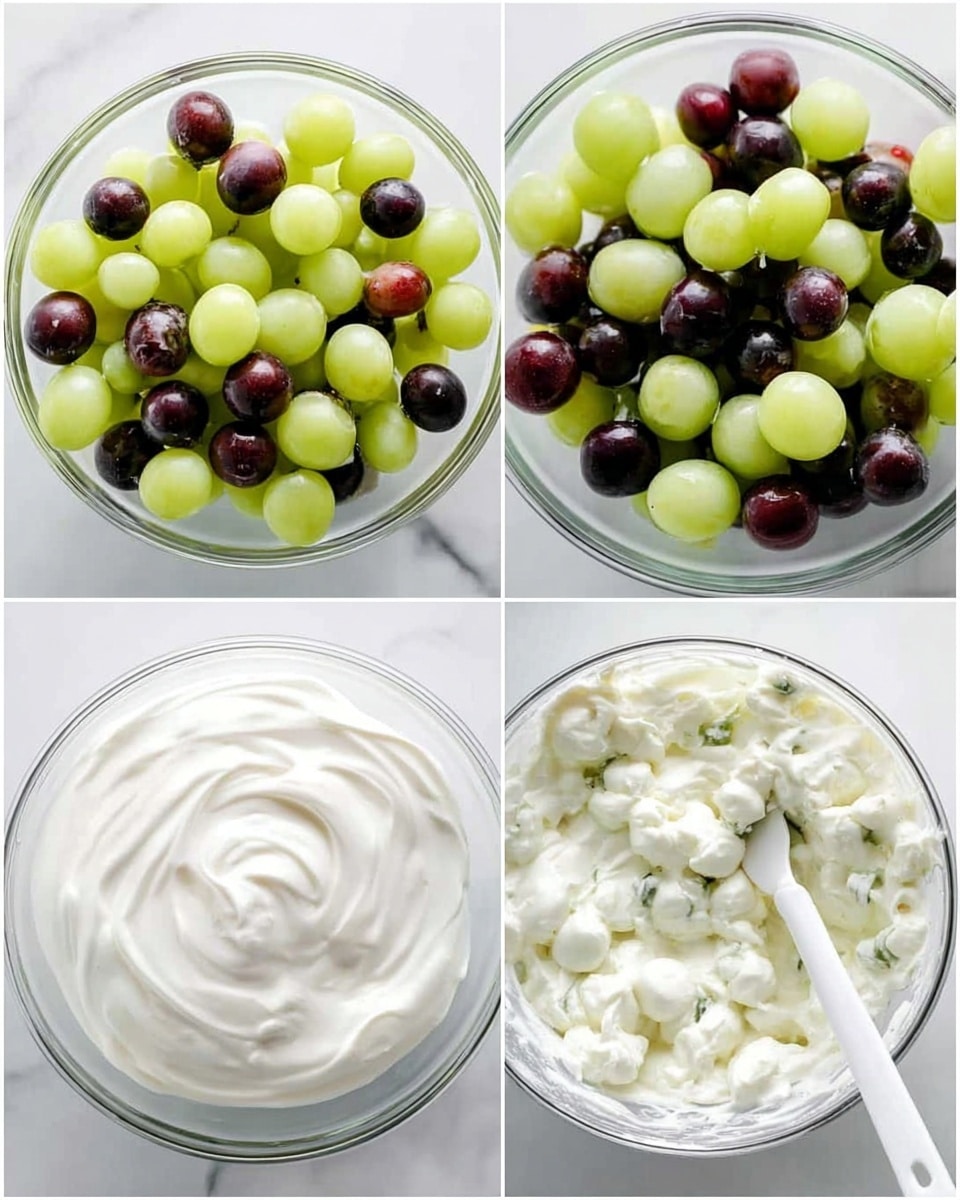 A bowl filled with green and purple grapes all covered in a creamy white sauce forms the first layer, topped with scattered light brown sliced almonds and fresh bright green mint leaves. The bowl is white and sits on a light gray and white checkered cloth over a white marbled surface. A gold spoon rests near the bowl with its handle pointing away. Photo taken with an iphone --ar 4:5 --v 7