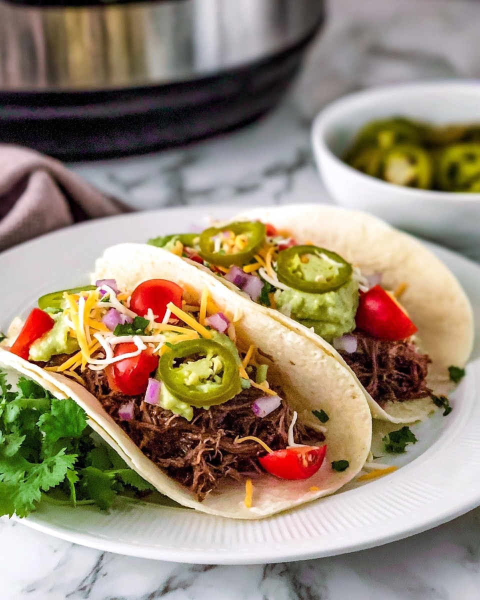 The image shows two soft white tortillas filled with several layers of ingredients. The bottom layer inside the tortillas is shredded dark brown meat, topped with chopped green lettuce and diced red tomatoes. On top of the vegetables, there is a mix of shredded yellow and white cheese and some slices of green jalapeño peppers. Small bits of chopped red onion and fresh green cilantro are scattered around and inside the tortillas. The tacos are sitting on a white plate with some chopped green cilantro garnishing the plate’s edge, all placed on a white marbled texture surface. Photo taken with an iphone --ar 4:5 --v 7